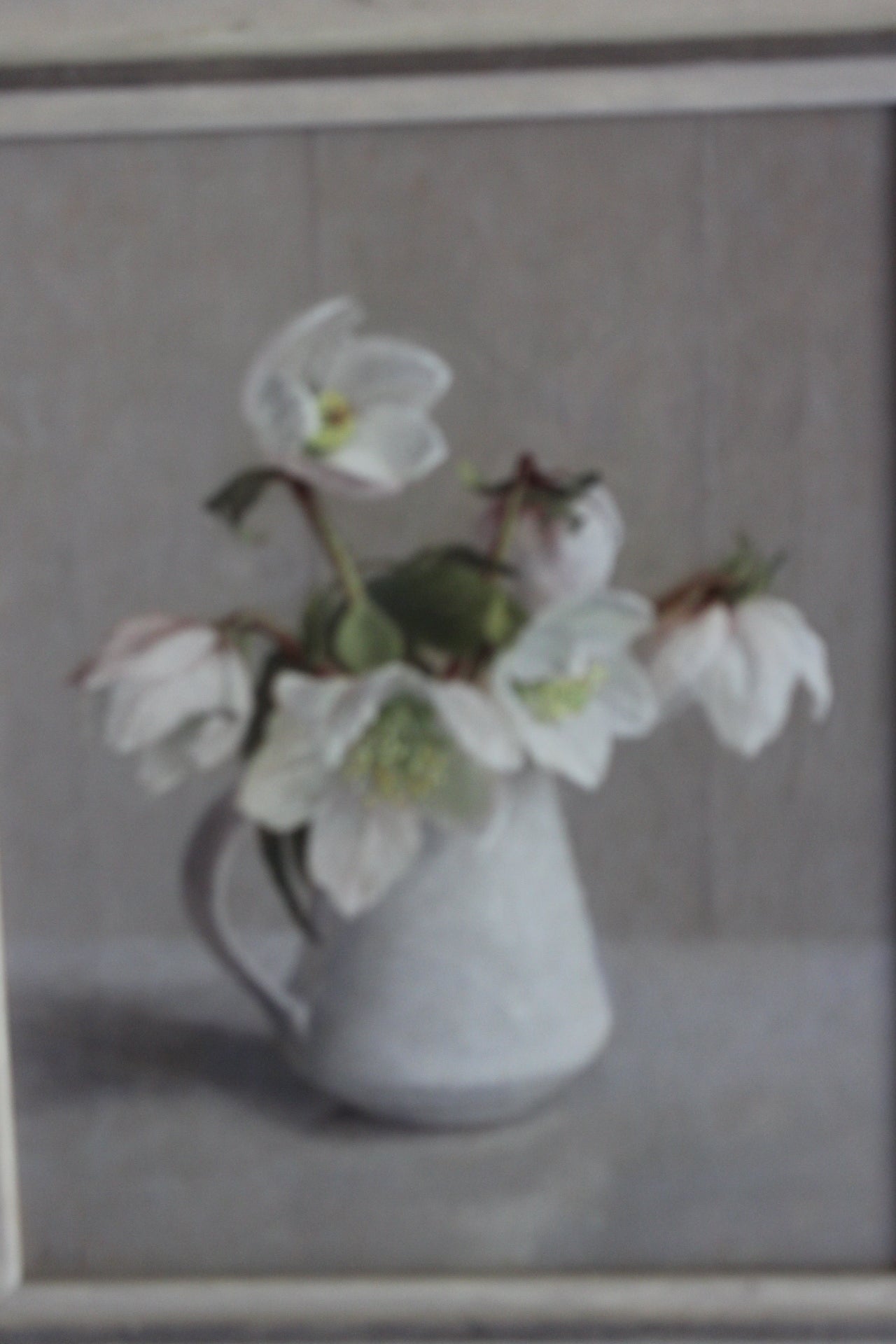 Beautiful oil painting of winter flowers, Christmas roses, in a Lucie Rie jug by British artist Anna Hornby