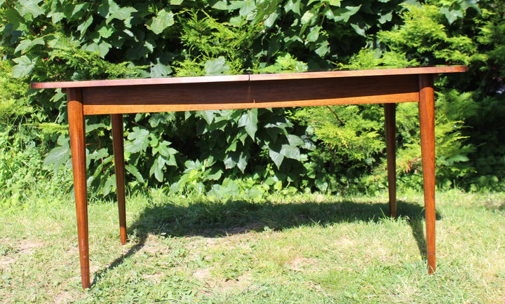 Classic mid-century Hamilton dining table in rosewood with an extendable leaf, designed by Robert Heritage for Archie Shine