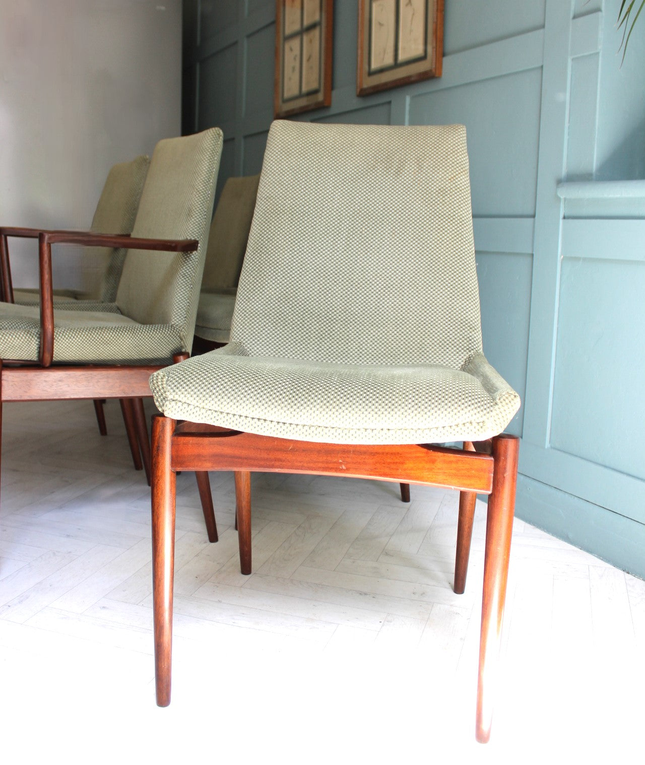 Close-up of a 1950s Danish Rosewood dining chair with a stylish turquoise-green wool seat and polished wood frame