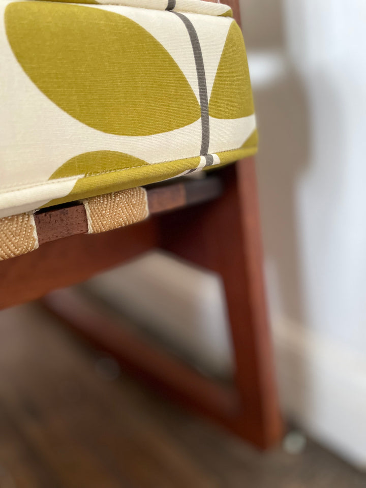 Close-up of teak wood grain and upholstery detail