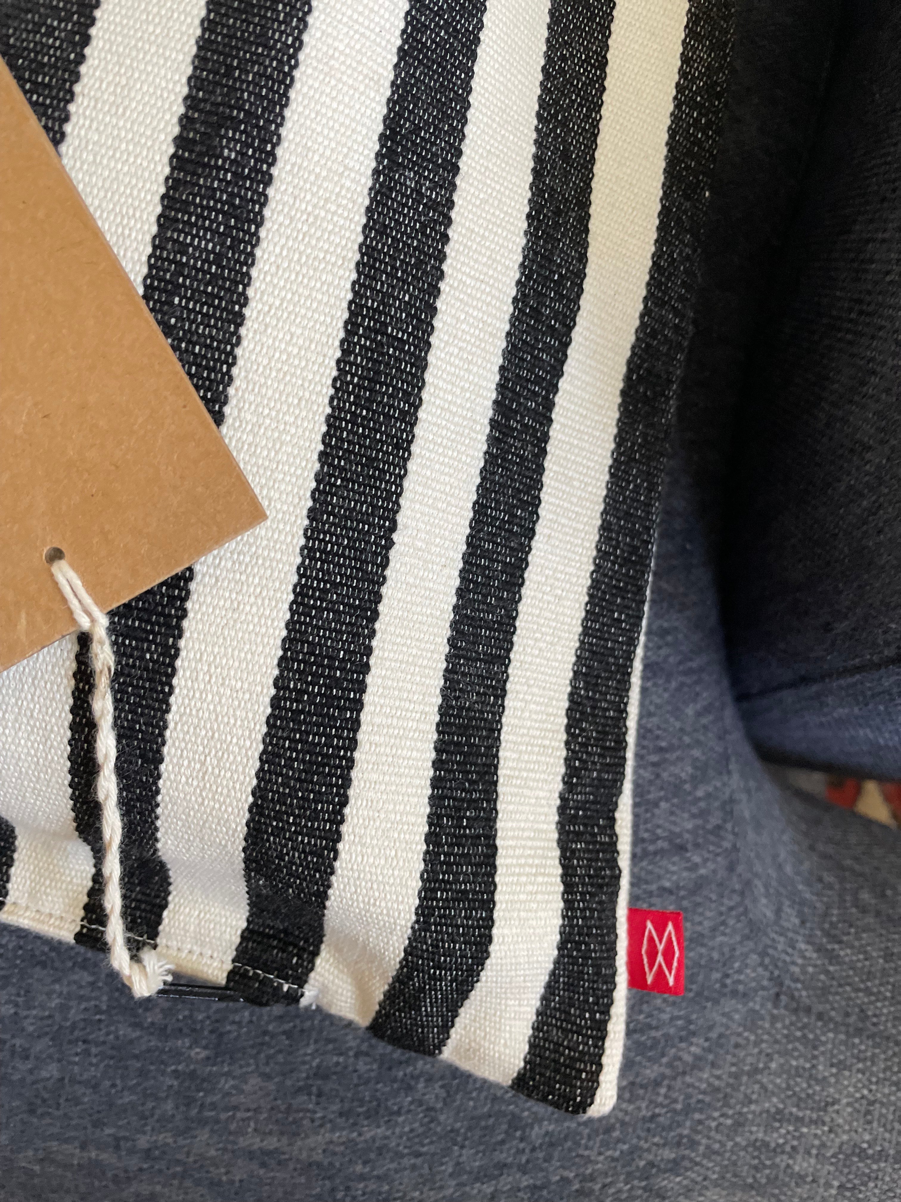 Detail of hand-printed stripes on neutral cushion cover
