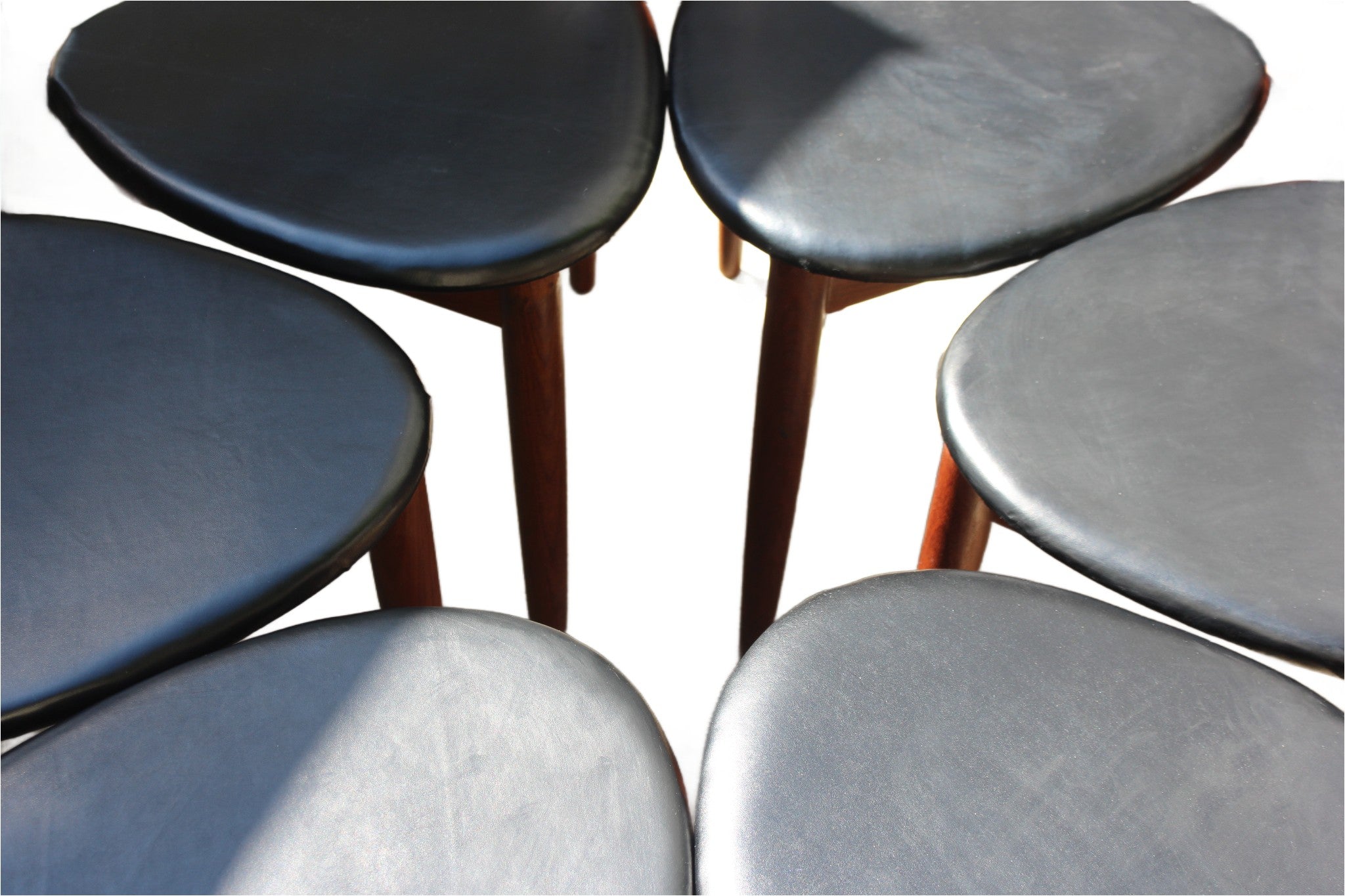 Teak dining chairs with sculptural Danish design