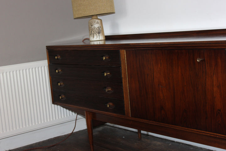 Honduran rosewood mid century sideboard with reeded drawers and book-matched doors