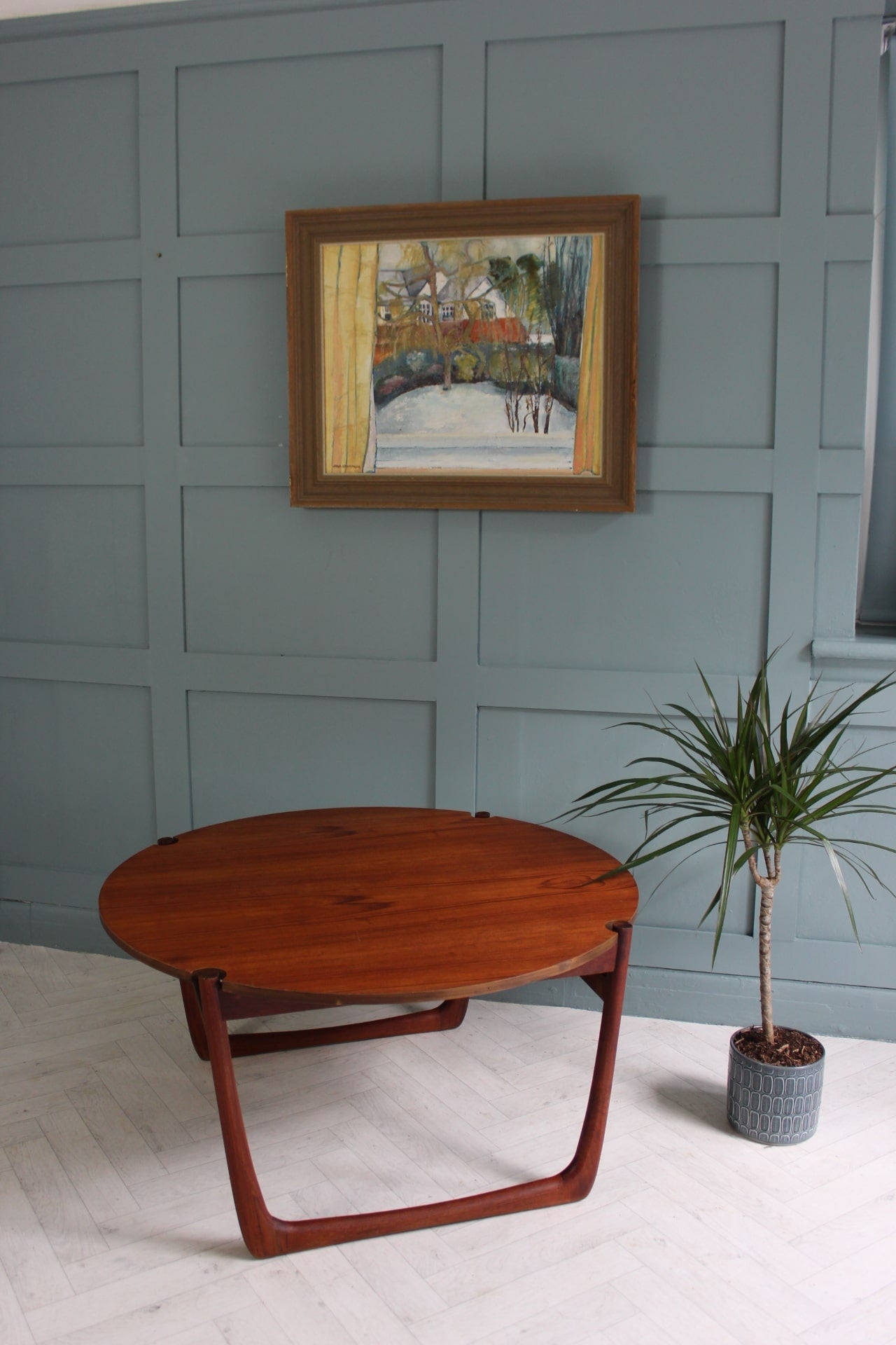 "Restored mid-century France & Son teak coffee table with round top and sleek design, perfect for modern living rooms."