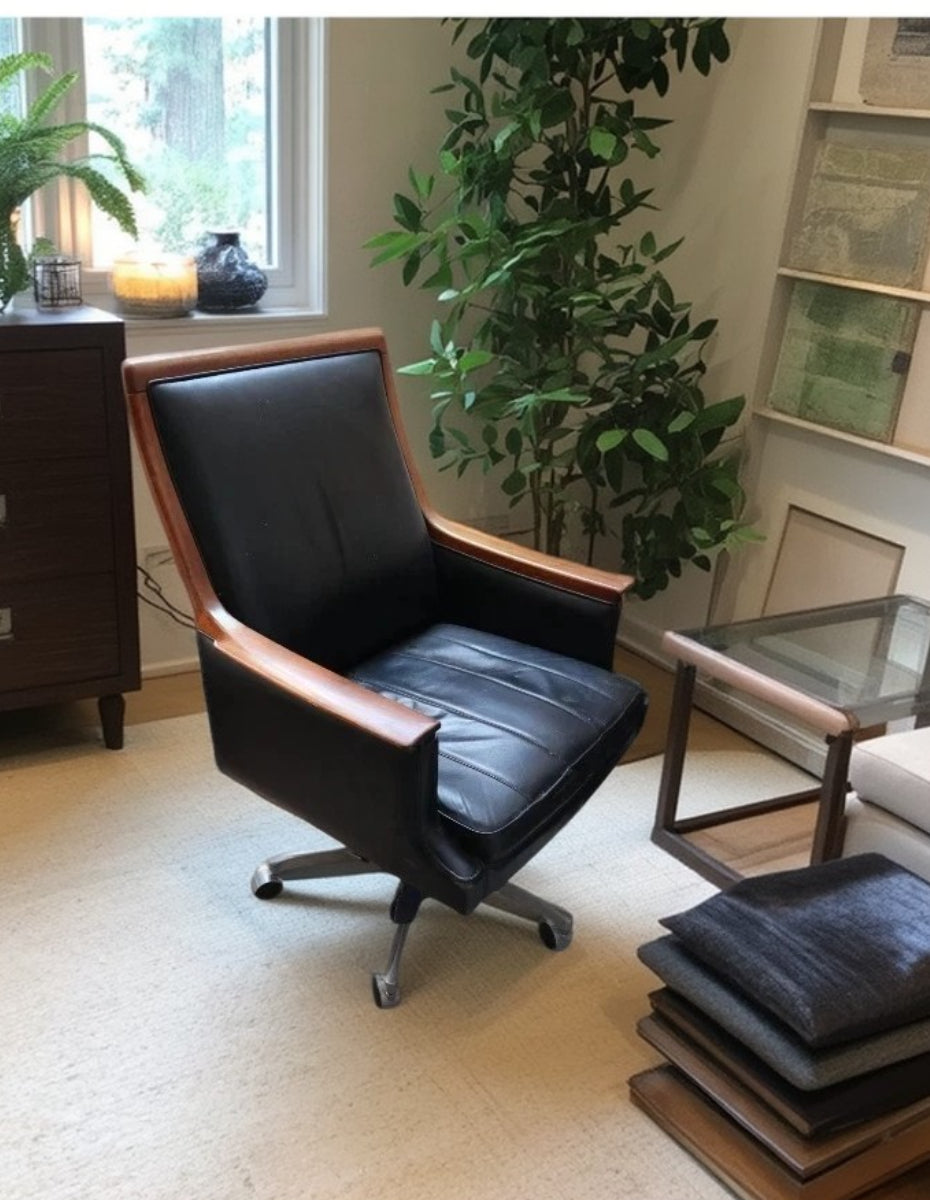 Side view of 1960s Minerva executive chair by Torbjørn Afdal in leather and rosewood