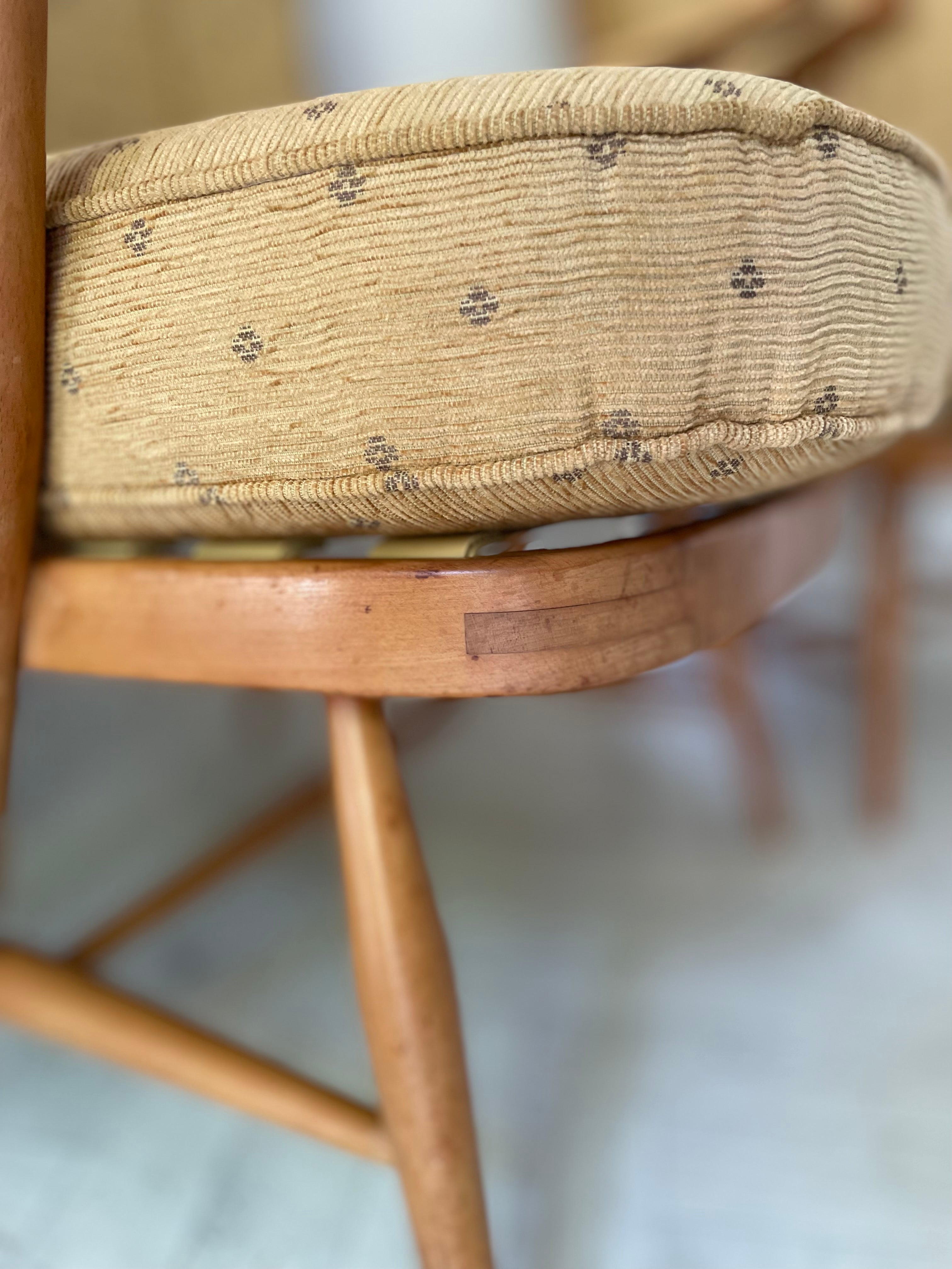 Close-up of a wooden chair with a woven seat on a blurred background