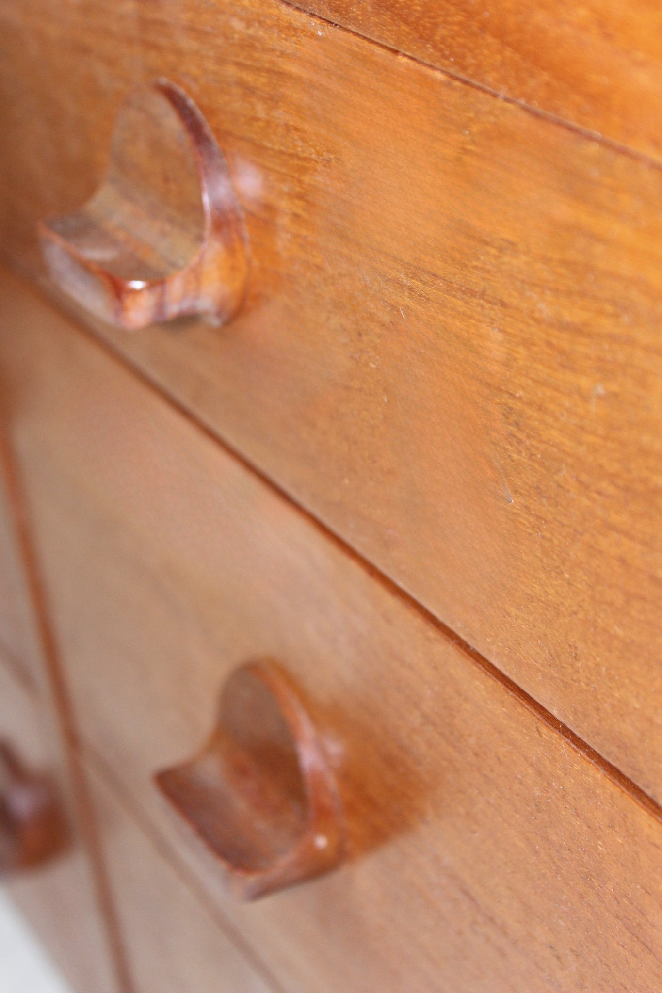 Minimalist teak storage dresser with elegant wood grain