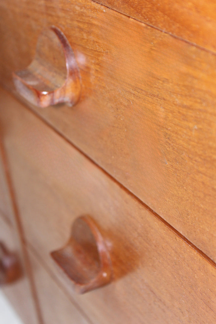 Minimalist teak storage dresser with elegant wood grain