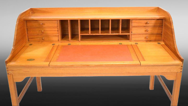 Retro wooden desk with brick-red leather writing blot