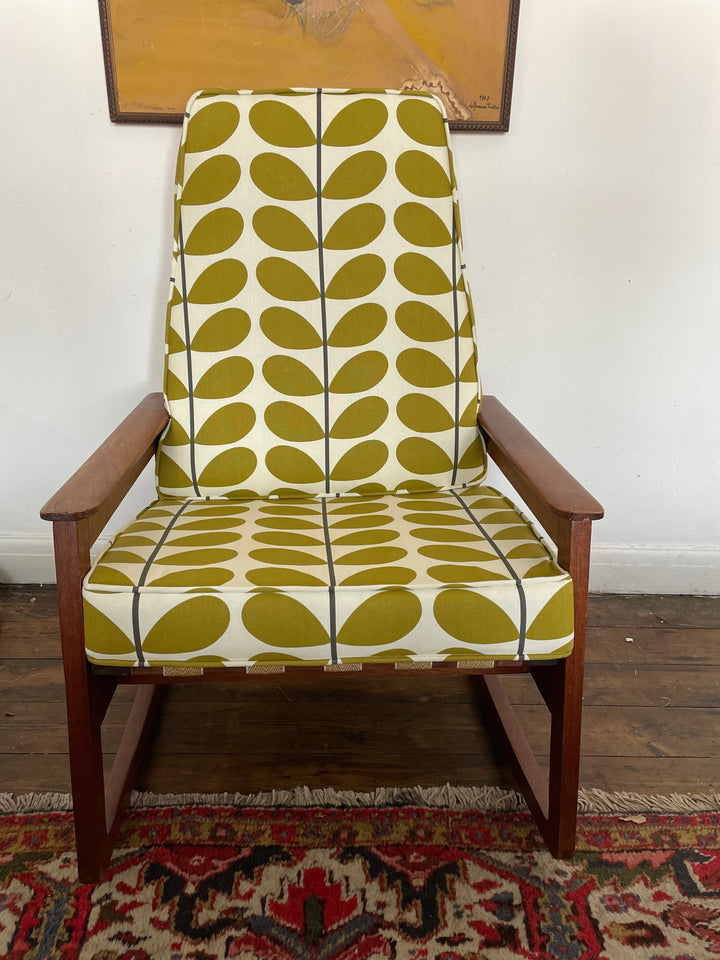 Teak frame rocking chair with colorful designer fabric seat