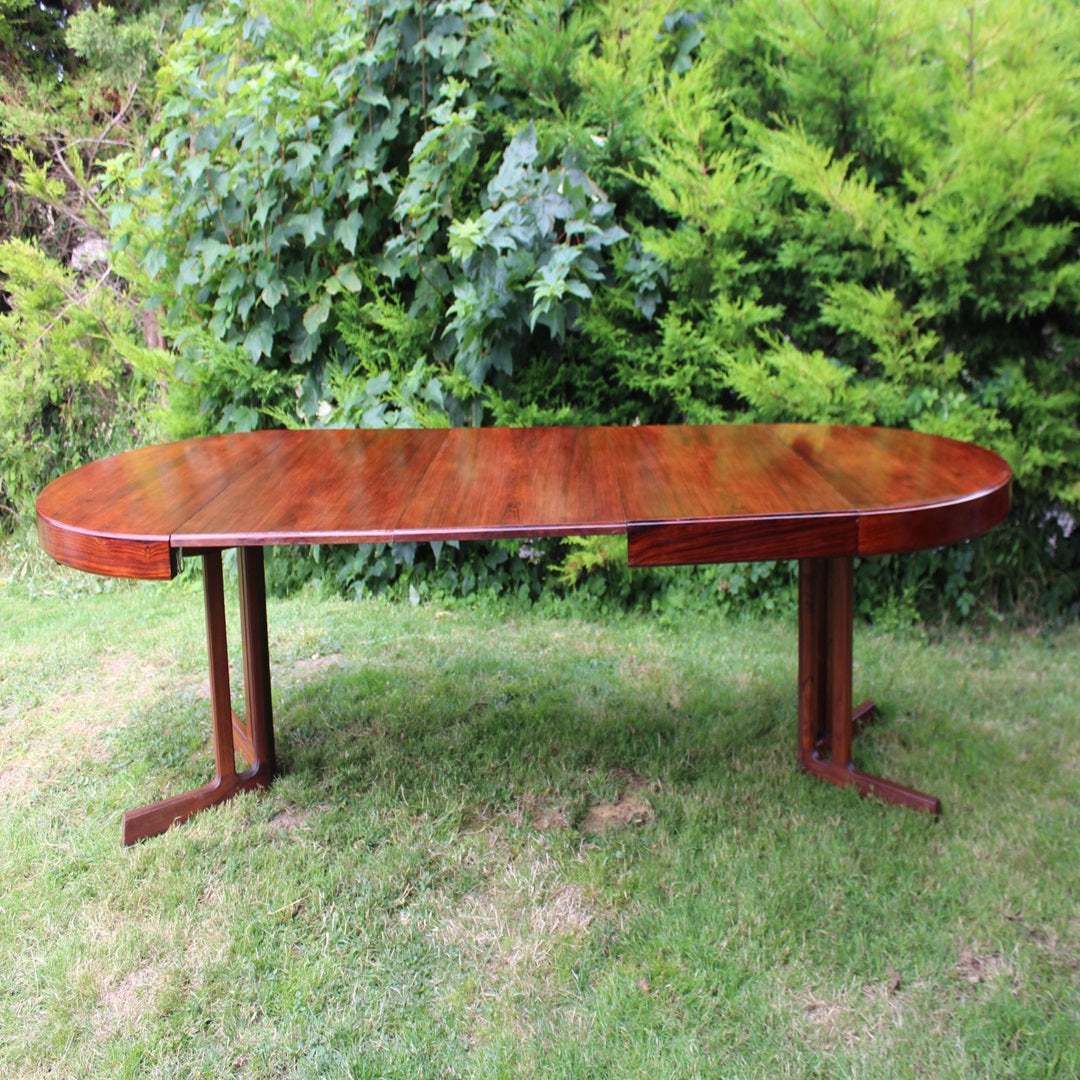 Vintage Danish modern dining table with a sleek rosewood finish.