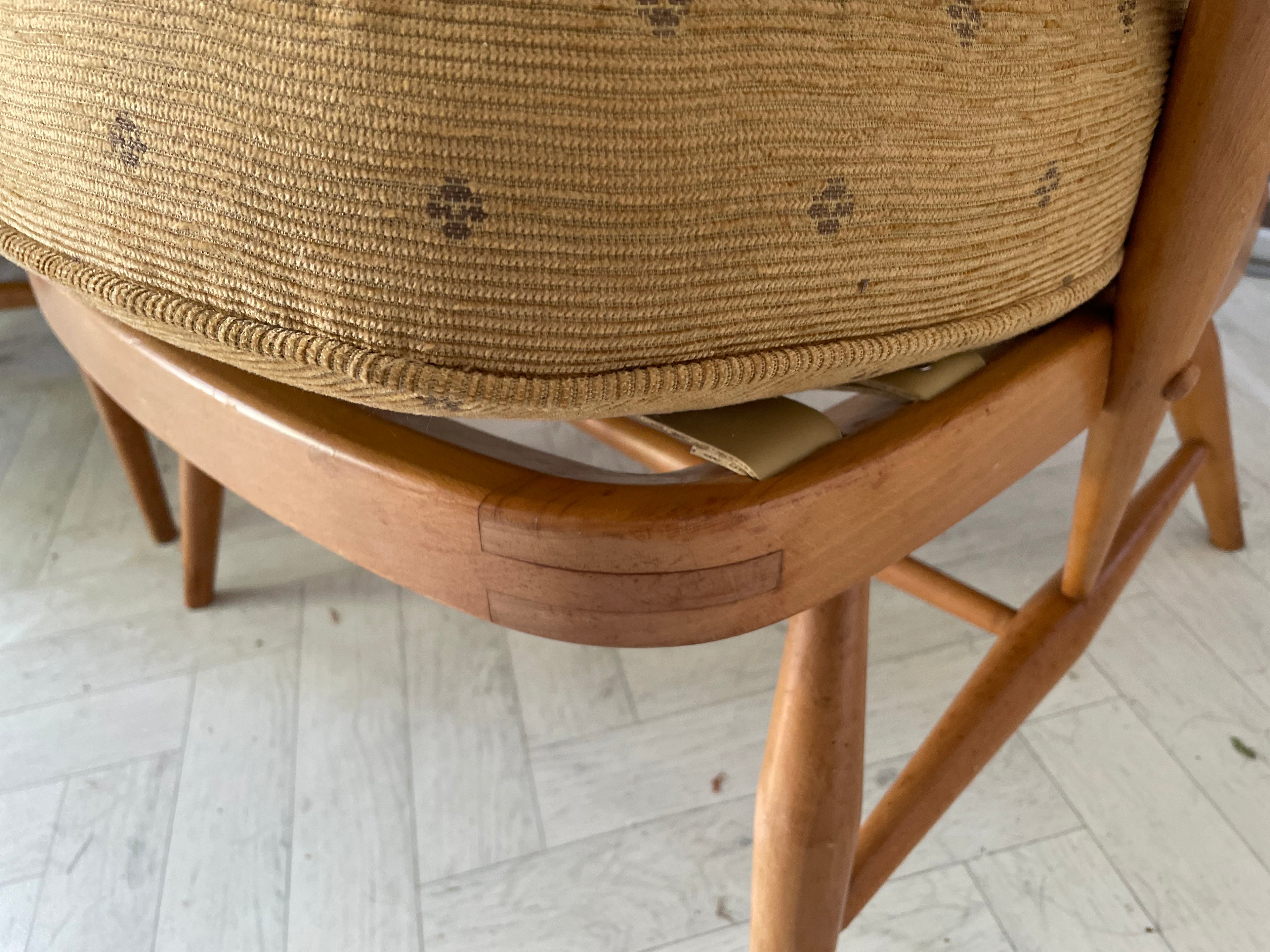 Wooden chair with woven seat on a light wooden floor