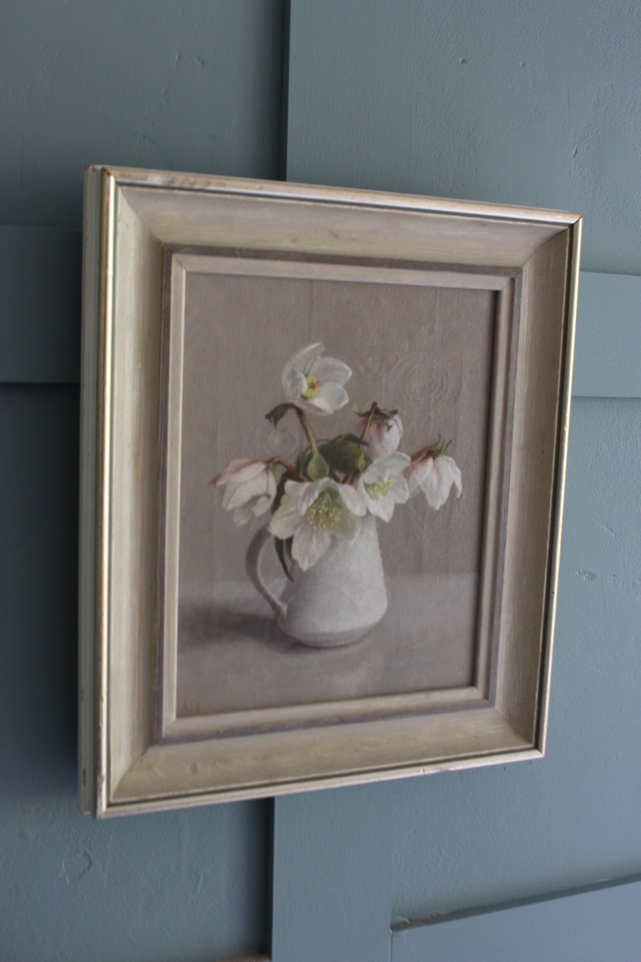 Winter still life art featuring Christmas roses in Lucie Rie jug, floral oil painting by Anna Hornby for home interior