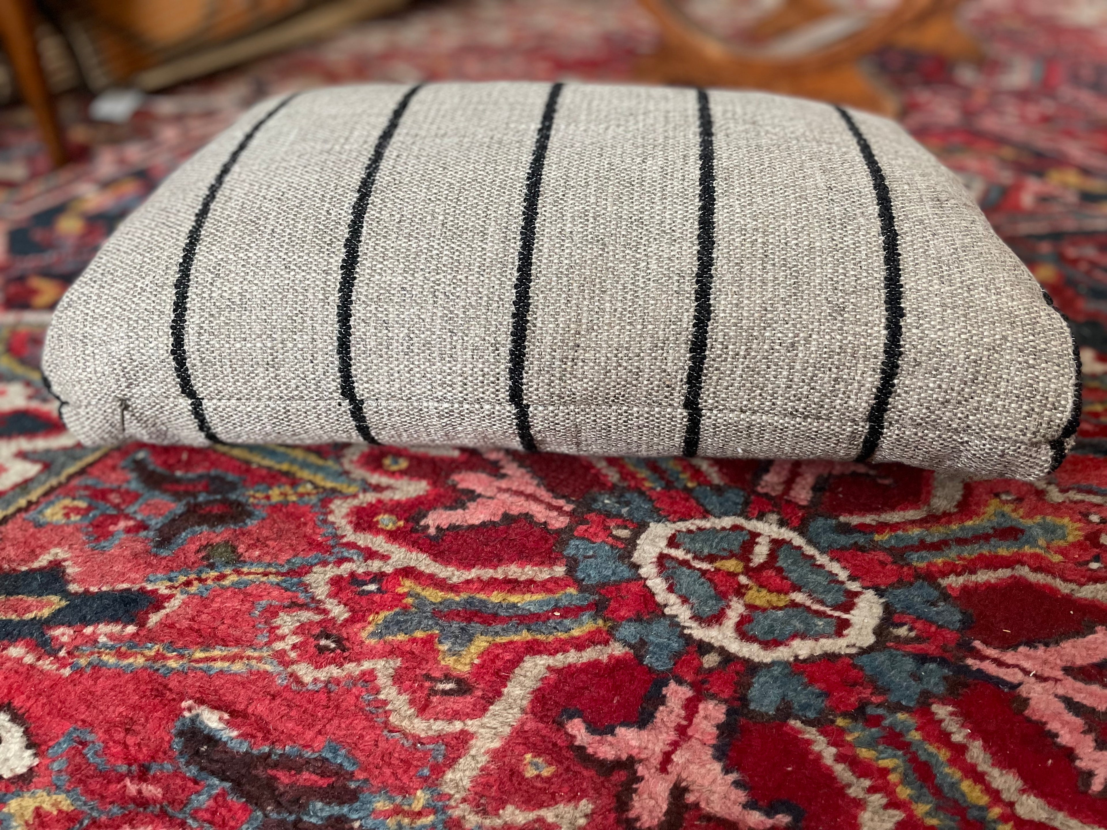 Close-up of striped bouclé fabric on vintage cushion
