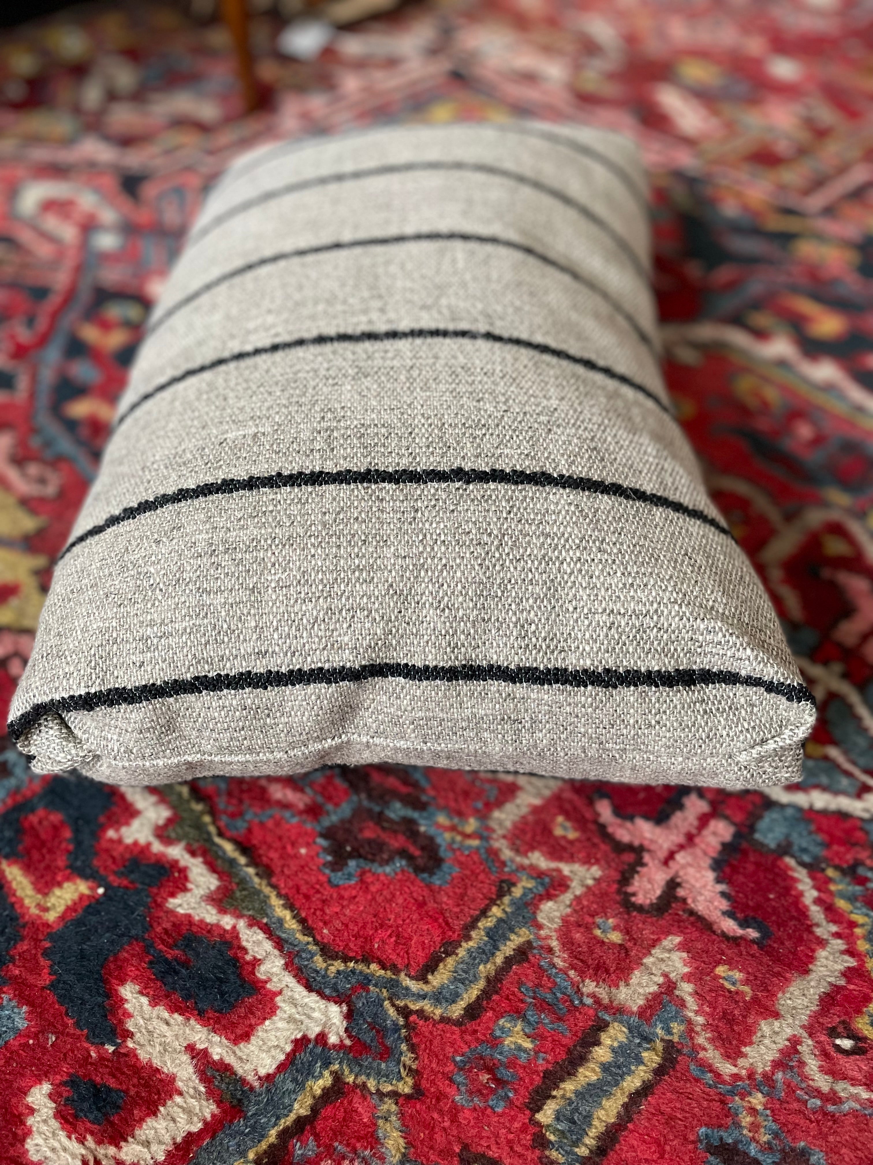 Decorative throw cushion with bouclé texture and stripes