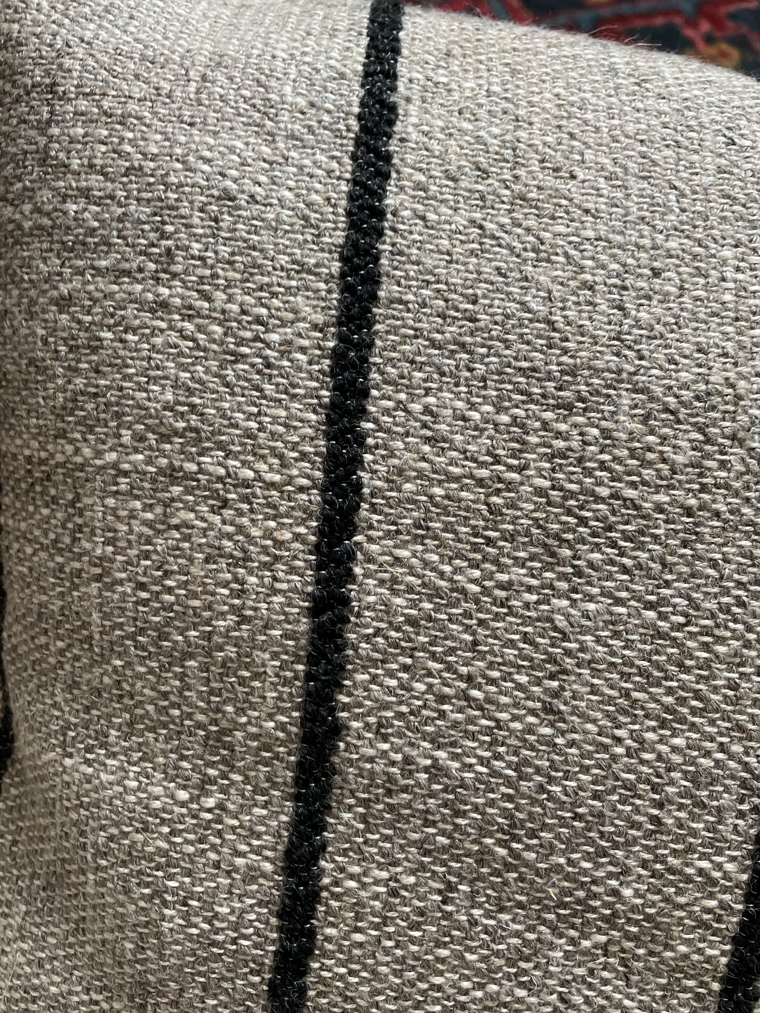 Soft grey and cream bouclé cushion for vintage interiors