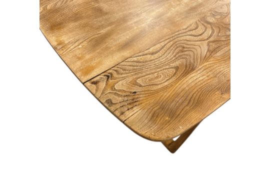 Elm-top dining table by Ercol with curved beech frame