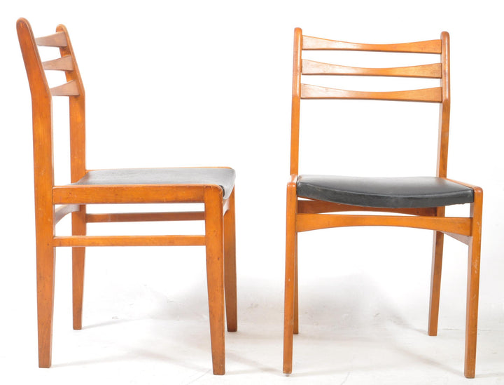 Side profile of 1960s Danish modern dining chair in teak