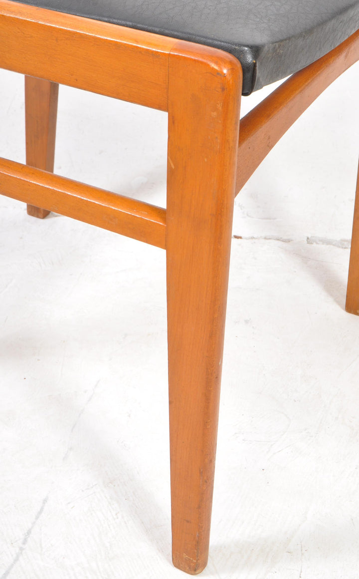 Farstrup-style Danish teak dining chairs with minimalist form close up