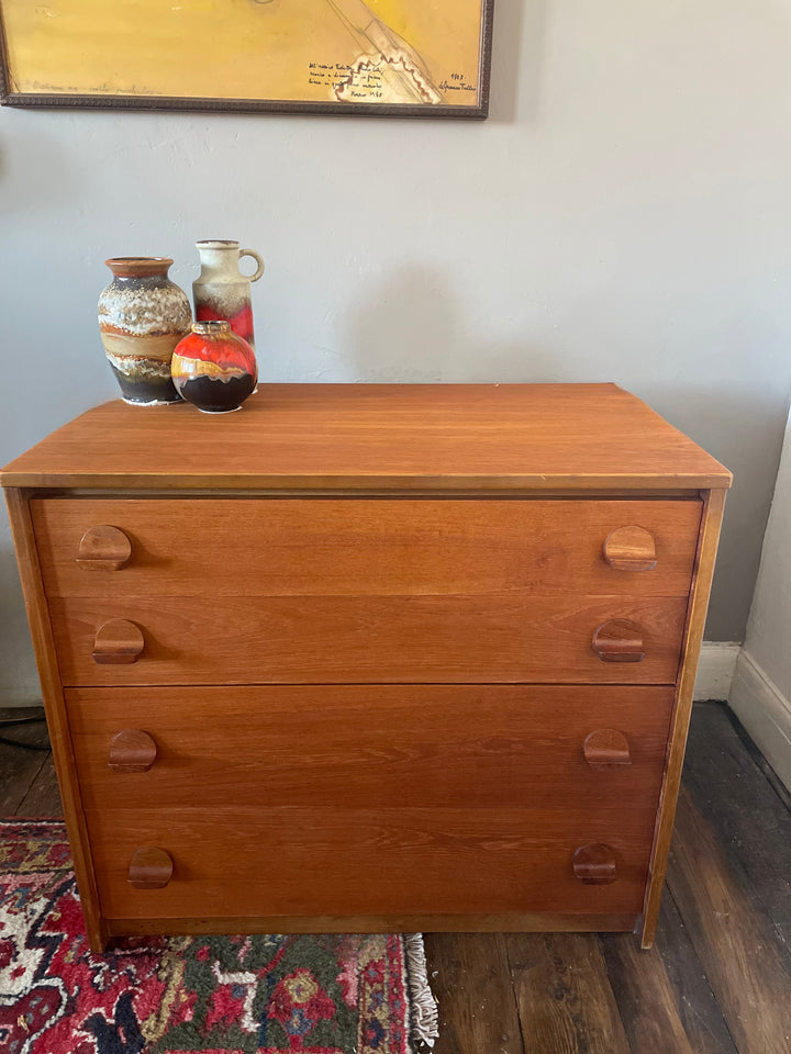 Side profile of mid century teak Stag Fineline tallboy dresser