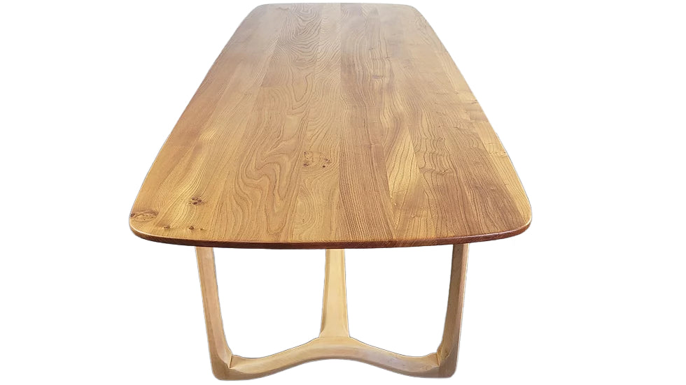 Ercol Elm and Beech dining table with a minimalist design on a white background
