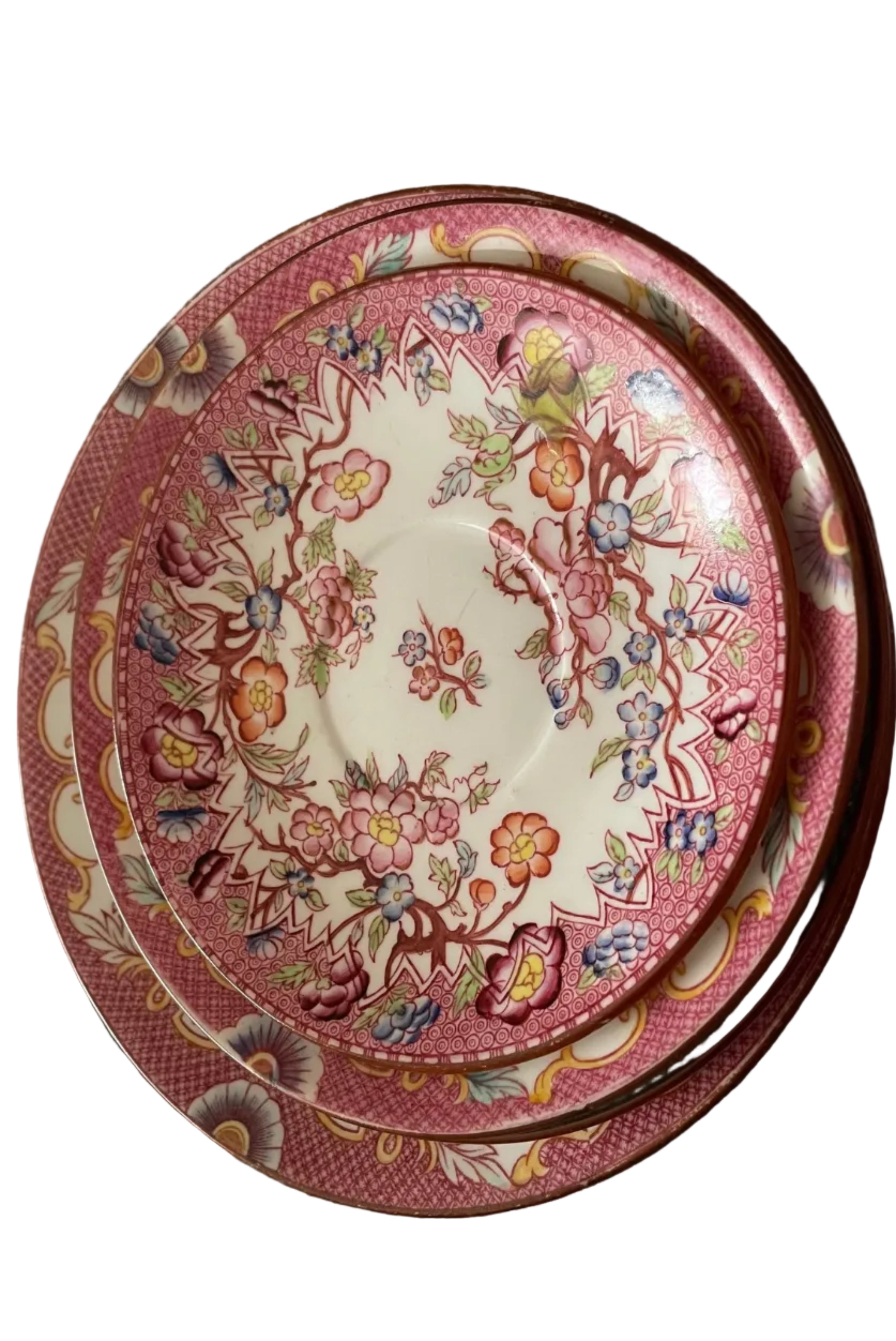 stack of three ceramic plates with a pink and gold floral pattern.