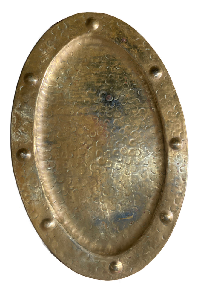 Antique brass tray displaying its naturally aged patina