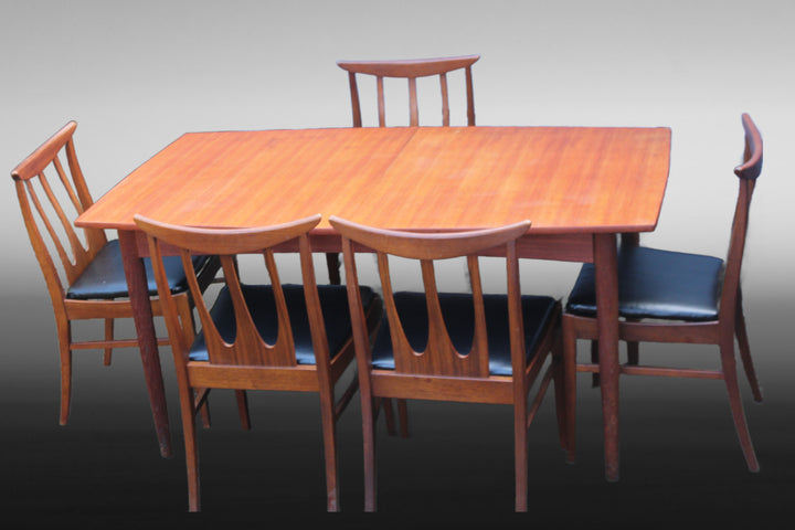Classic Mid-Century Modern dining set with restored vintage chairs