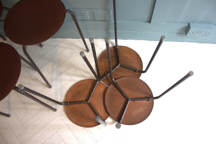 Compact and stylish Danish teak stool with plastic-capped feet