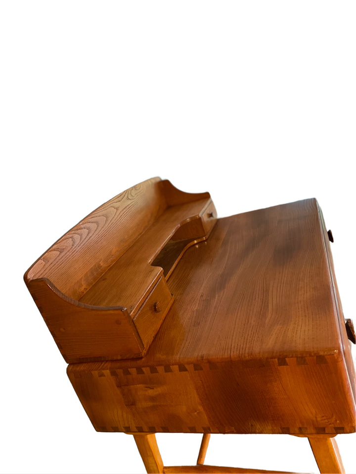 Drawer detail of vintage Ercol 439 desk in elm and beech