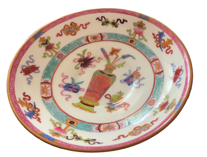 colorful hand-painted ceramic plate with a floral and decorative pattern