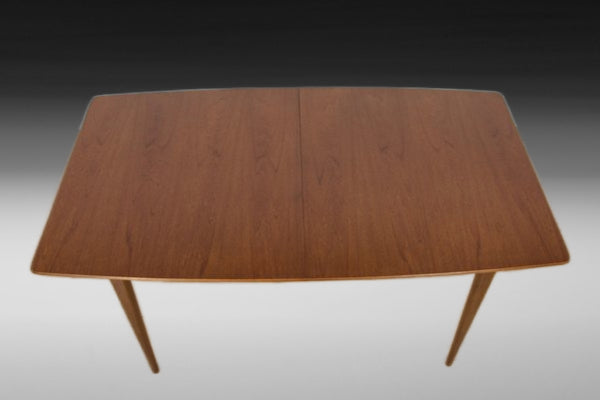Extended McIntosh T2 dining table revealing hidden butterfly leaf for extra seating