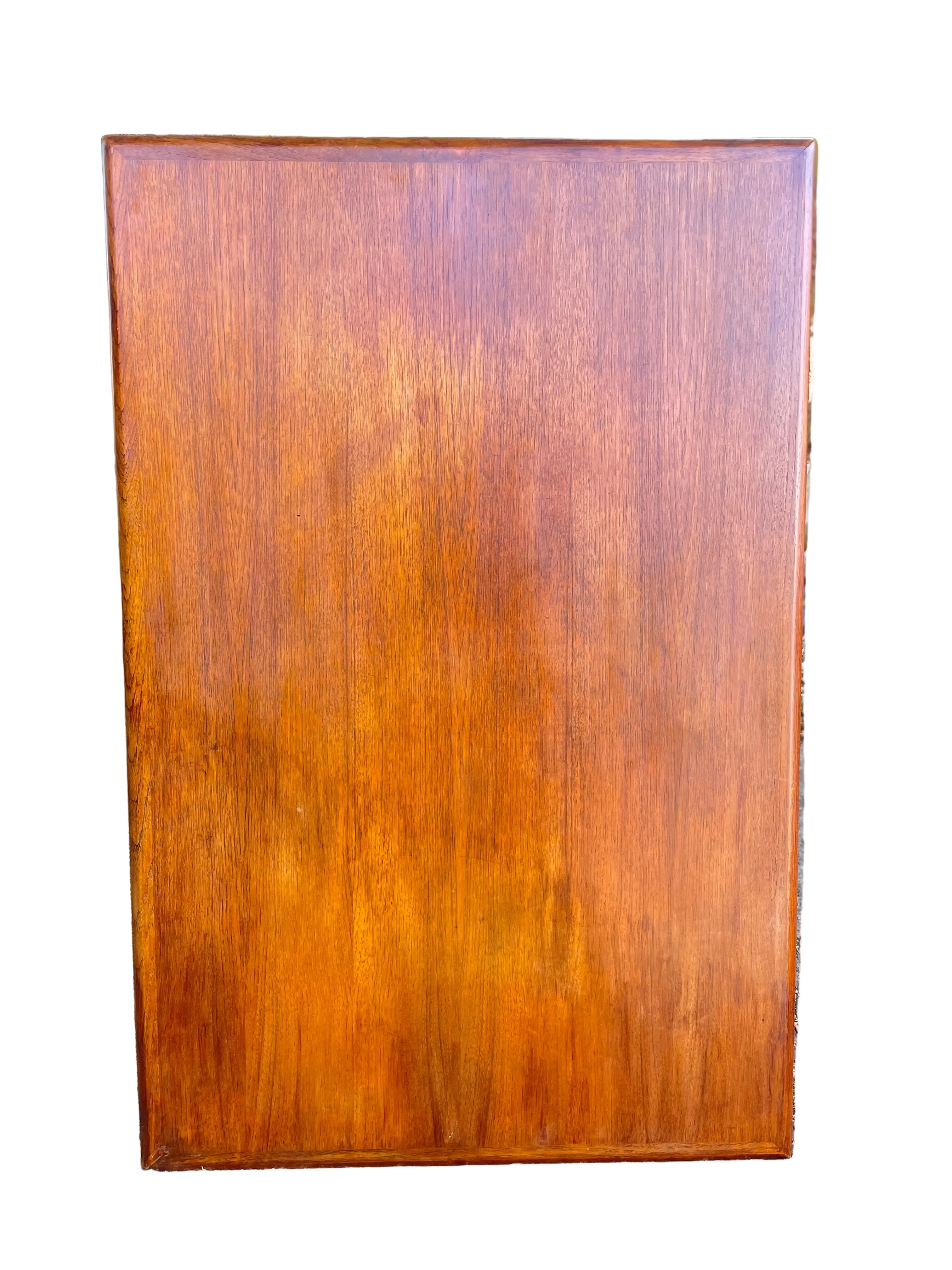 rectangular wooden cabinet or sideboard with a glossy warm brown finish.