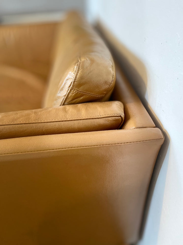 Close up tan leather sofa Danish Stouby
