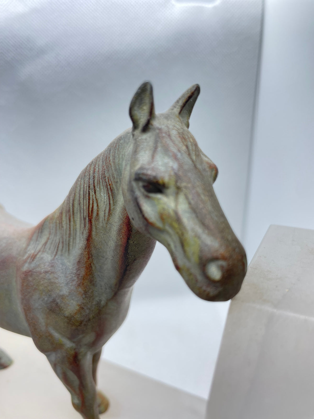A Pair of Art Deco Style Patinated Bronze & Onyx Horse Bookends