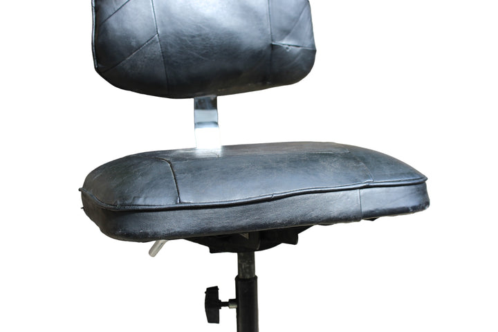 Mid-century industrial chair with a rustic appeal and functional design