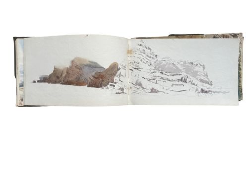 Open 19th-century Guernsey sketchbook showing historic paintings