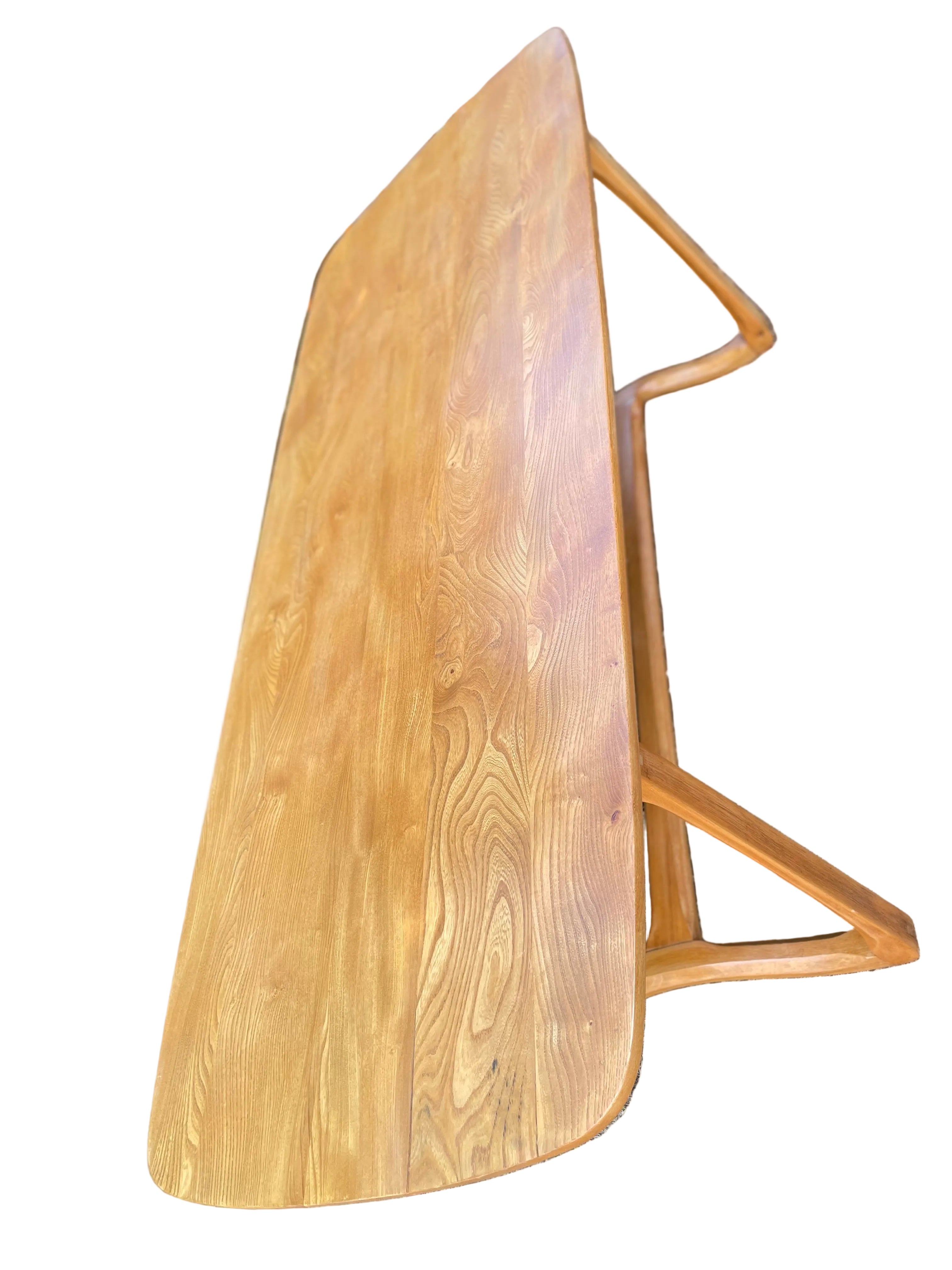 wooden dining table with a warm honey finish and visible wood grain