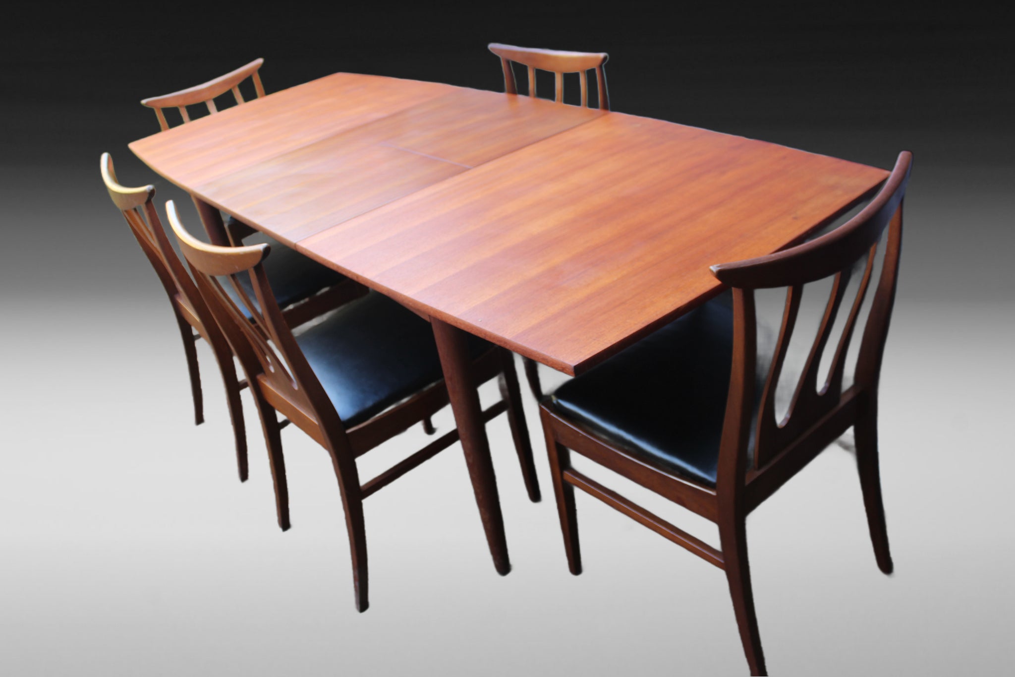 Refurbished Mid-Century dining chairs with new black vinyl upholstery