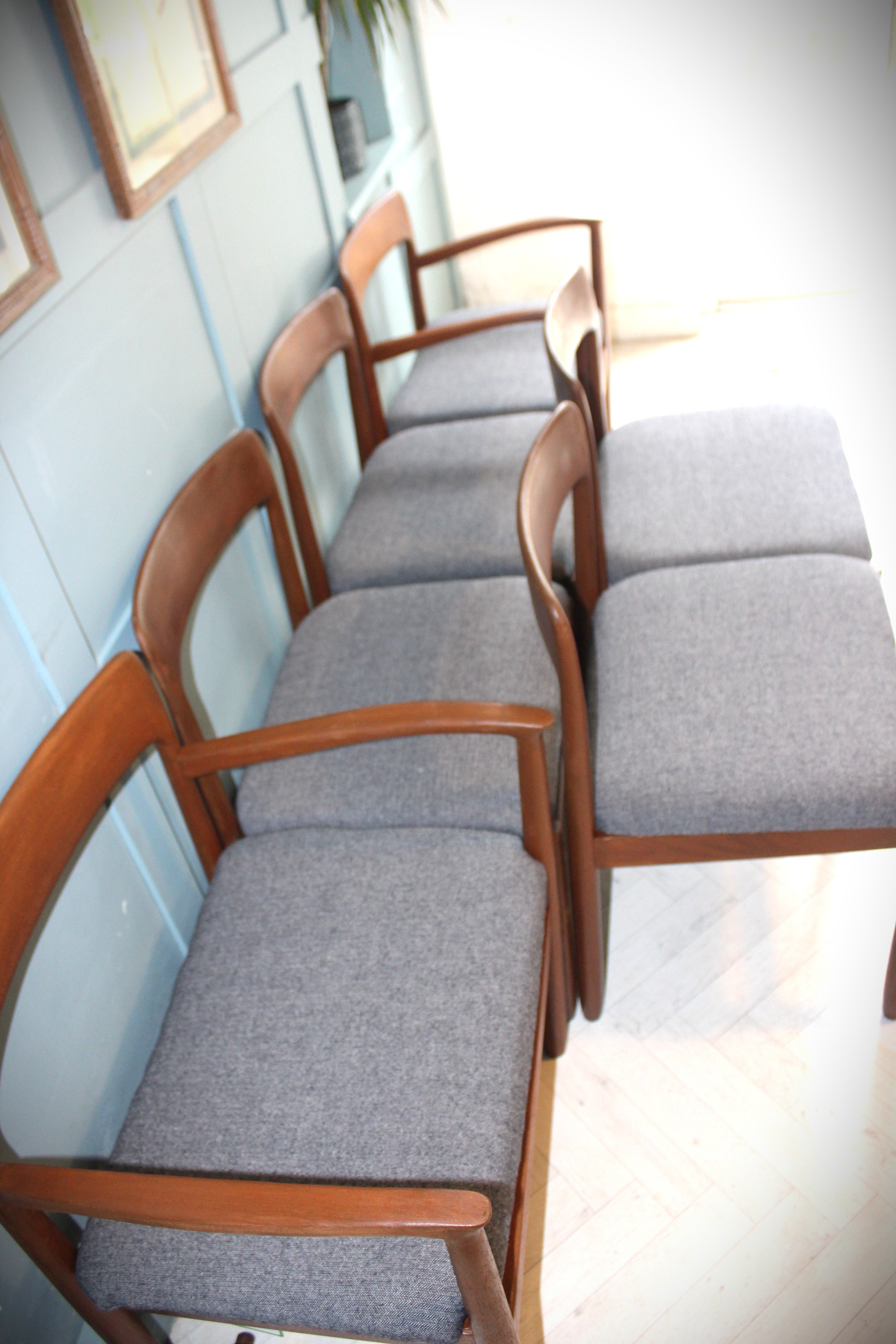 Scandinavian-inspired mid-century dining set with teak wood grain detail