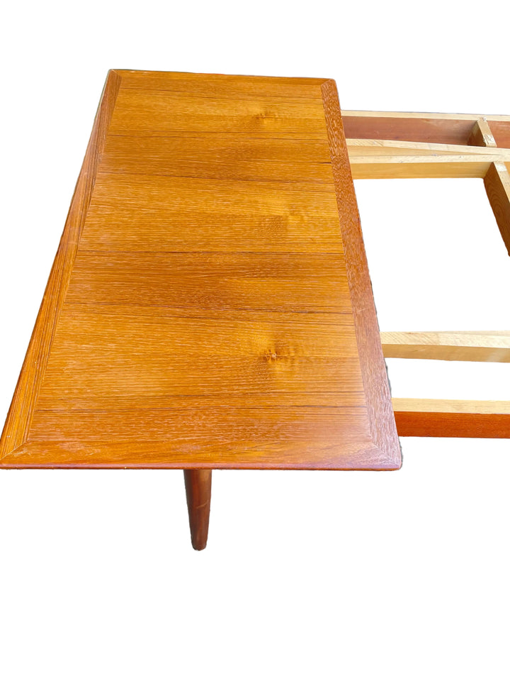 A rectangular wooden table with a glossy warm brown finish and visible wood grain