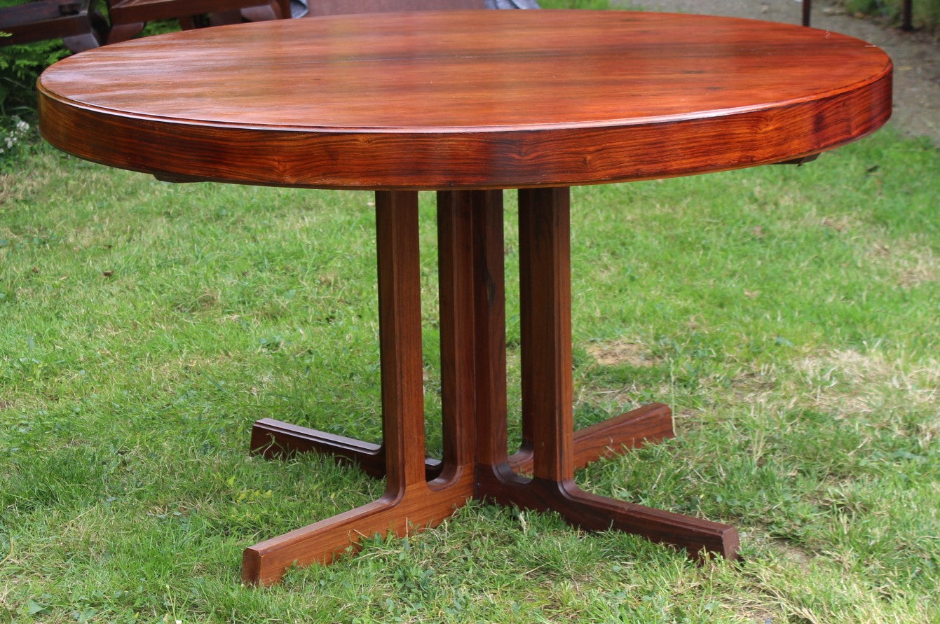 Vintage Danish modern dining table with sleek lines and a warm wood tone