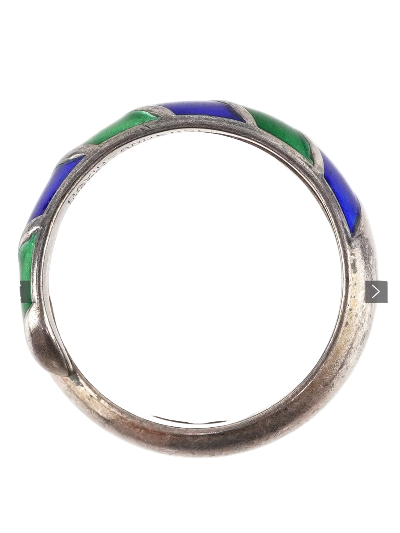 Silver ring with blue and green enamel on a white background