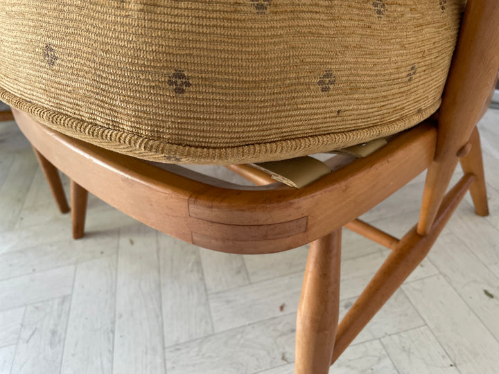 Wooden chair with woven seat on a light wooden floor