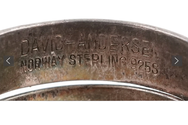 Close-up of a silver ring with 'David Andersen Norway Sterling 925S' engraving.