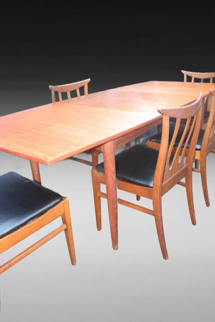 Vintage teak dining chairs with sculptural design and Danish oil finish