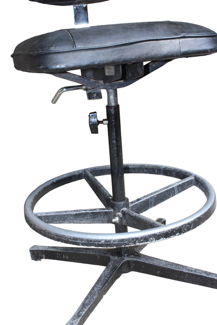 industrial chair with swivel mechanism and steel arm 