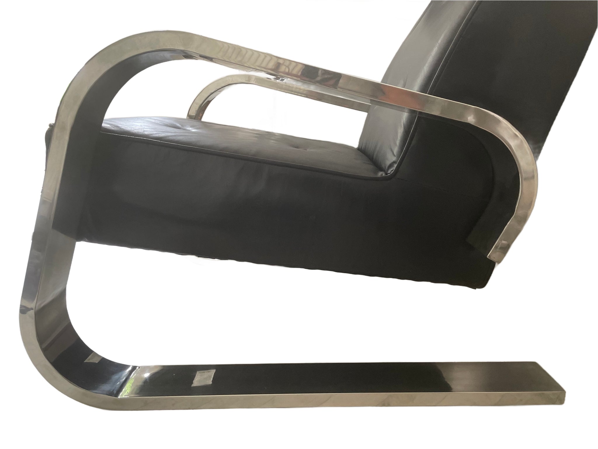 mid century Modern 1970s chair with black leather seat and silver metal frame on a white background