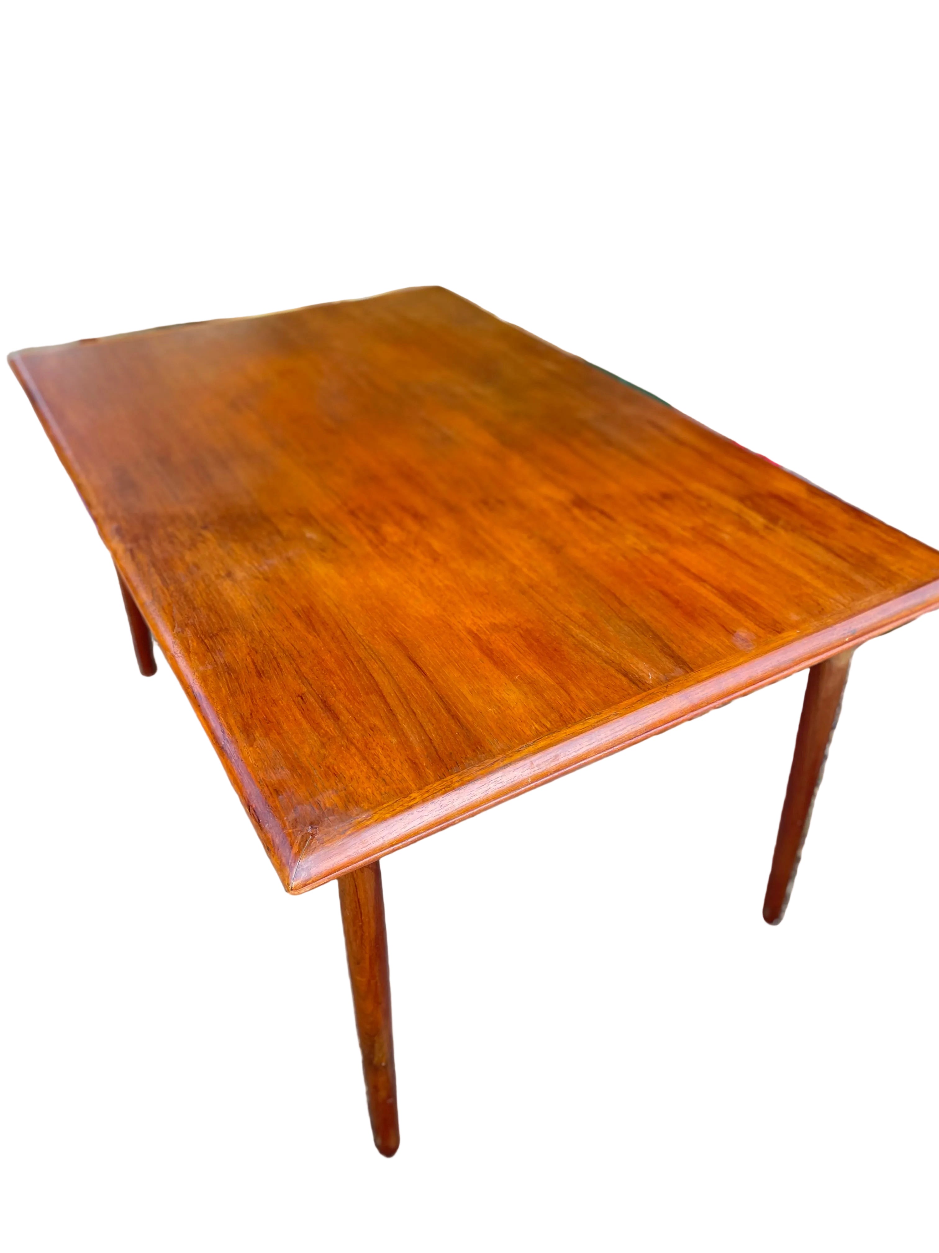 rectangular wooden dining table with a glossy warm brown finish